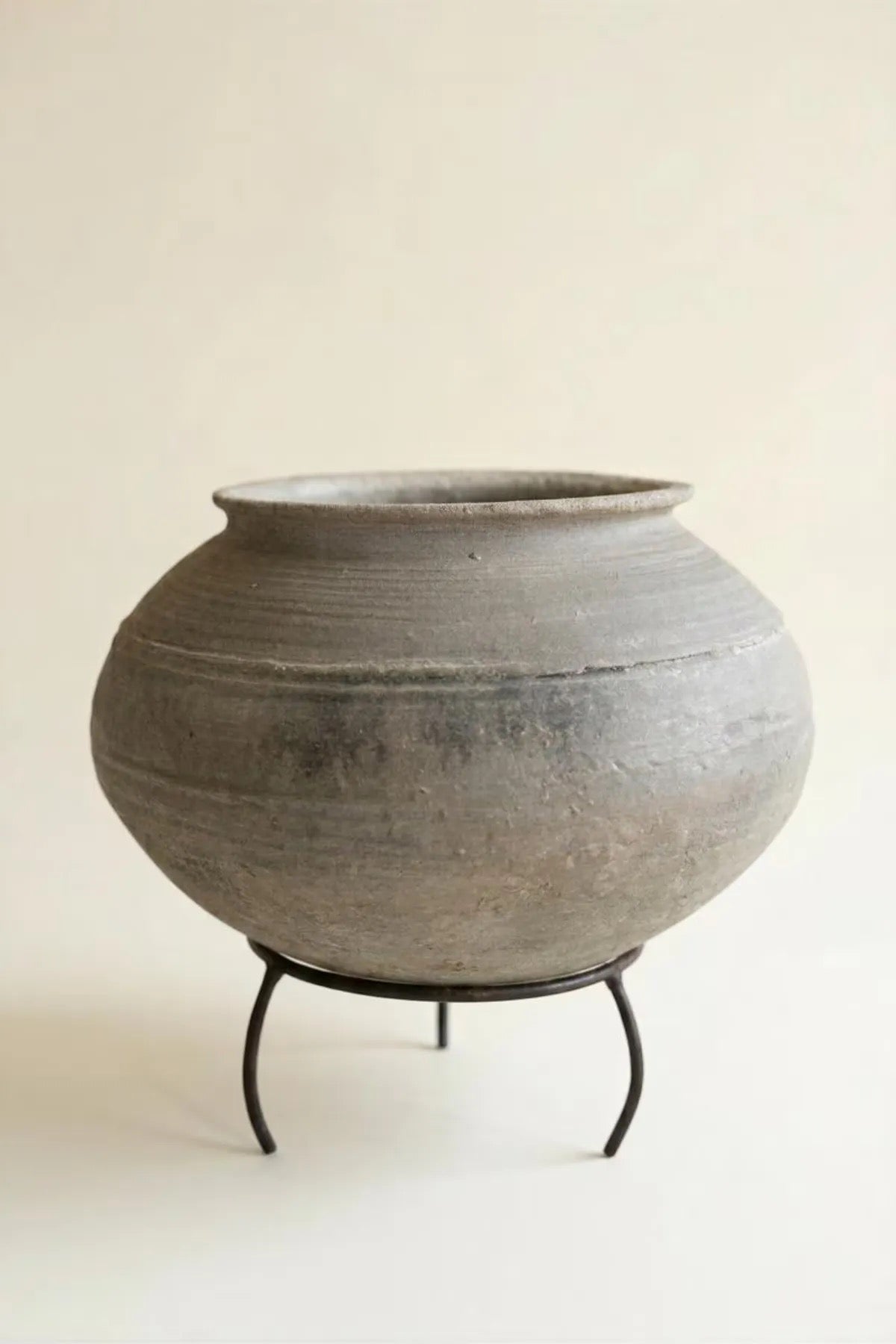 Black Clay Urn on an Iron Stand